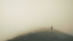 Man walking in the fog